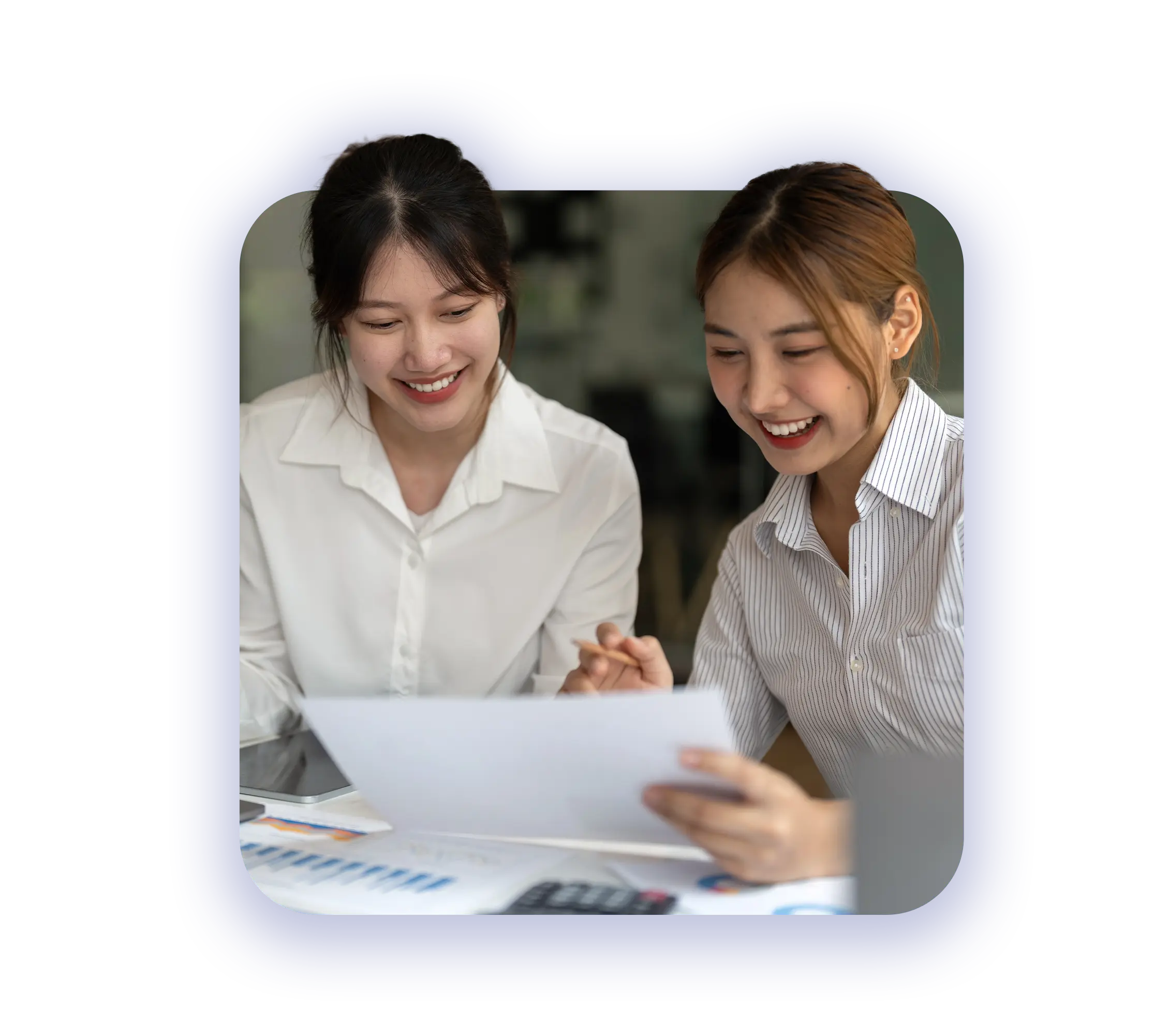 trusted tax compliance and accounting services - happy female business partners looking at accounting records